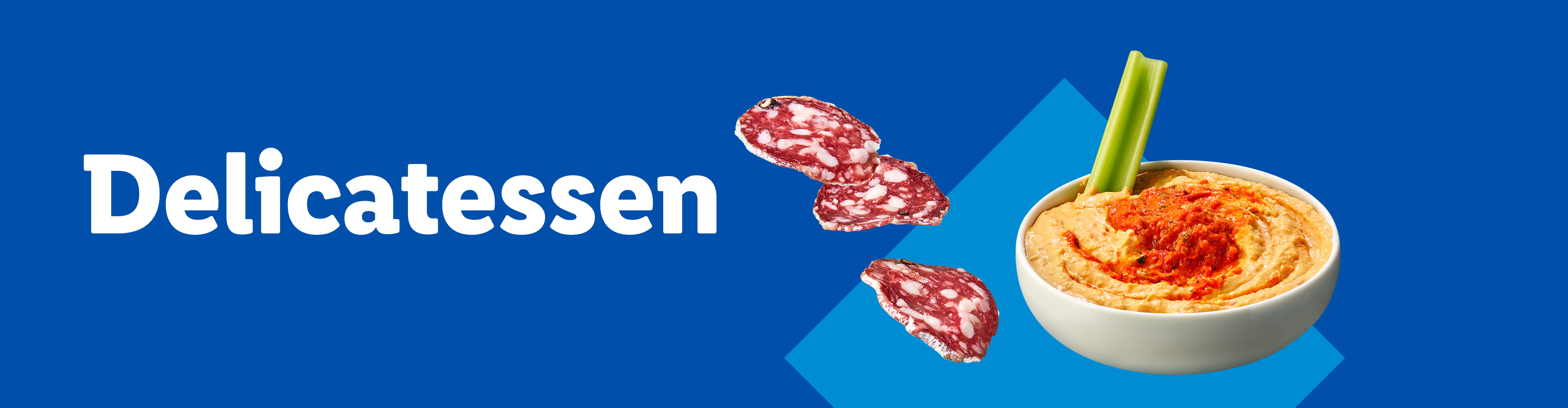 Salami slices and a bowl of hummus with a celery stick on a blue background.