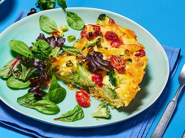 Broccoli, tomato, and pasta quiche with salad.