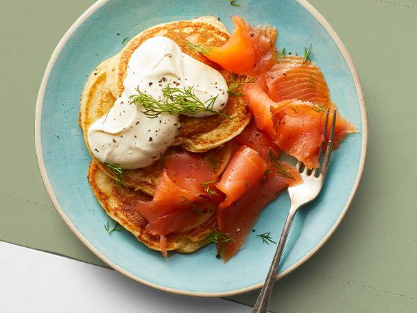 Pancakes with smoked salmon and cream.