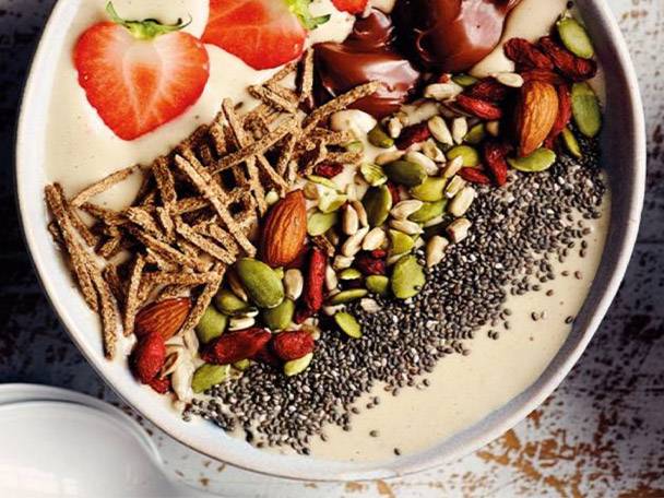 Smoothie with strawberries, nuts, and chia seeds.