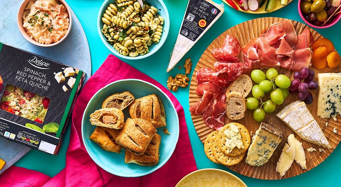 Spinach quiche, salami, cheeses and other treats.