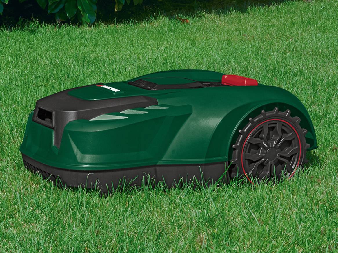 Gardena robotic lawn mower on green grass.