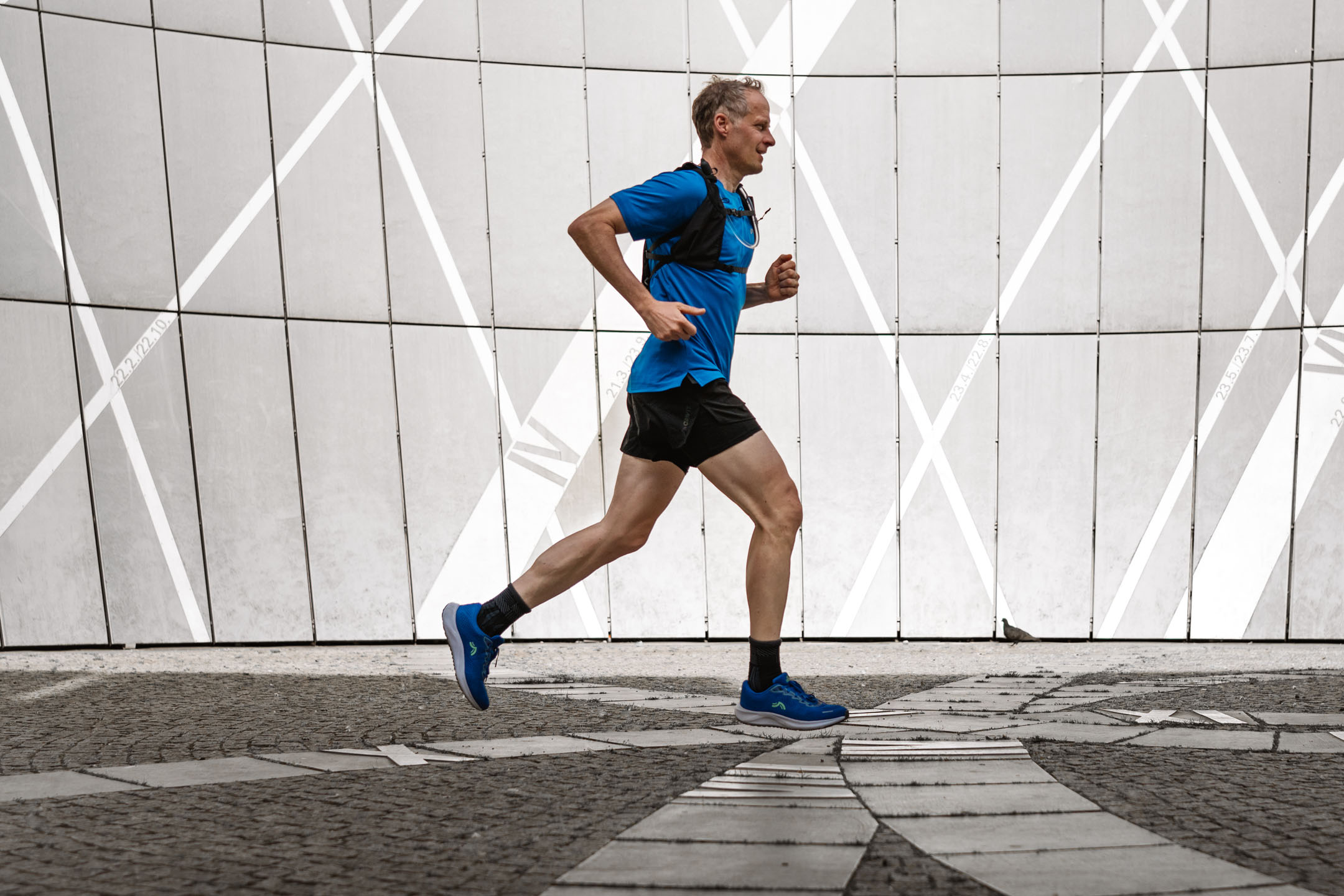 Man running in athletic shoes.