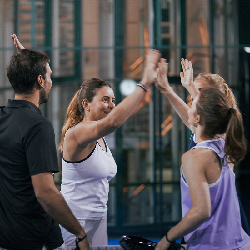 Padel players celebrating a win.