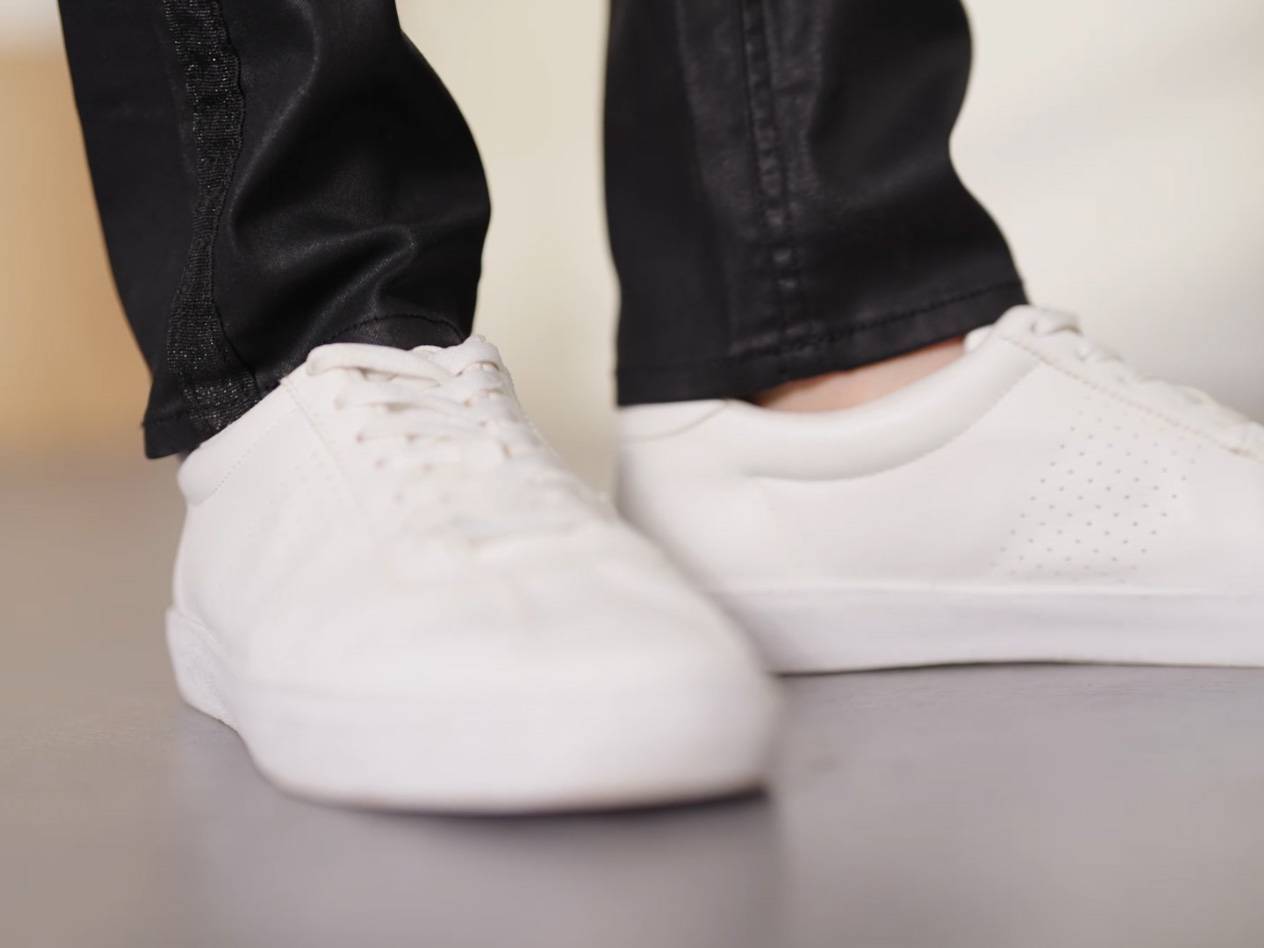 White sneakers with black pants.